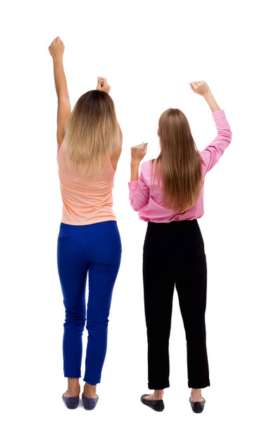 Back view of two young  women dancing. - Фото, изображение