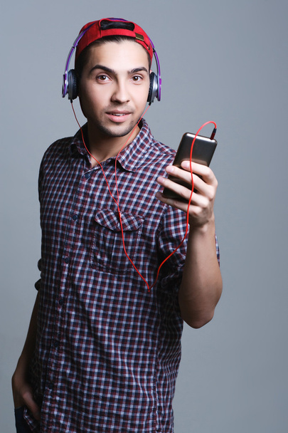 male teenager with headphones in the studio, - Fotografie, Obrázek