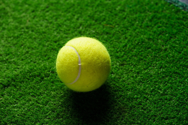  tennis ball  on the green artificial grass - Fotó, kép