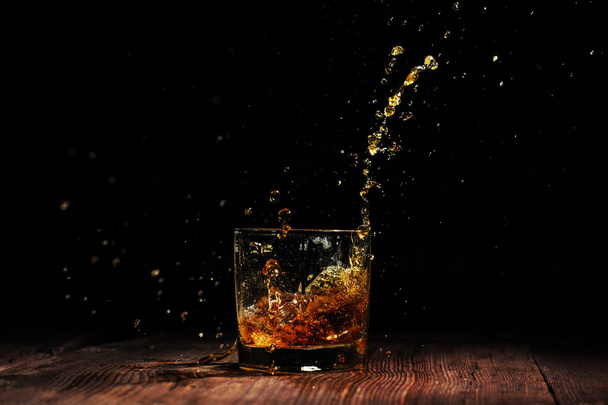 cognac on the wooden table - Foto, Bild