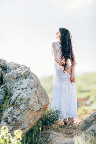 Young woman in white dress outdoors  - Photo, image