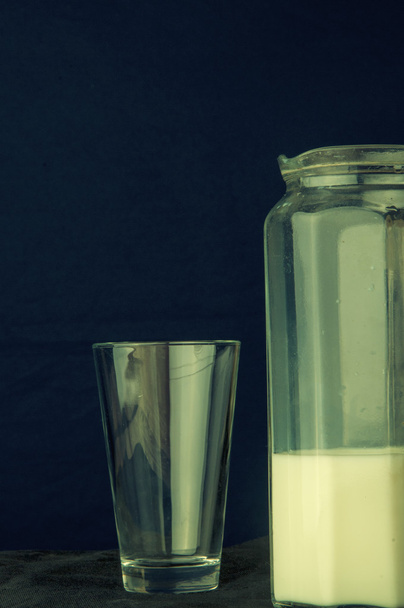 Milk on a dark background - Фото, зображення