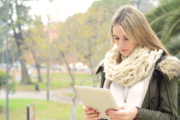 Portrait of a young woman using her tablet. - Fotó, kép