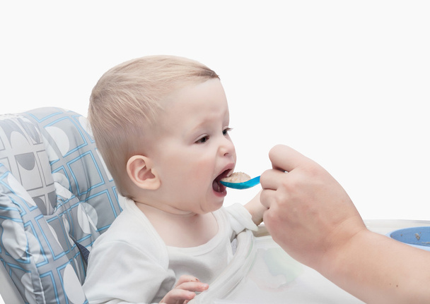 The father feeds with porridge of the one-year-old kid - Fotografie, Obrázek