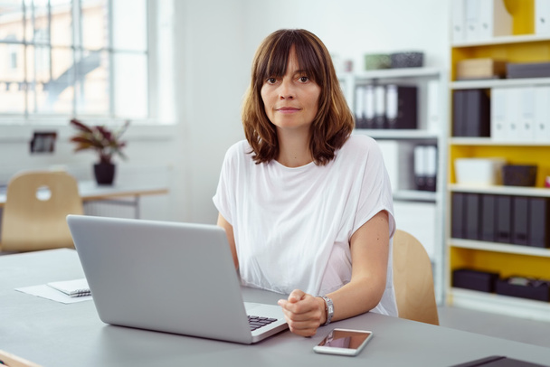 Middle-aged businesswoman working at a laptop - Fotografie, Obrázek