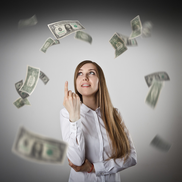 Pointing. Woman in white and dollars. - Фото, изображение