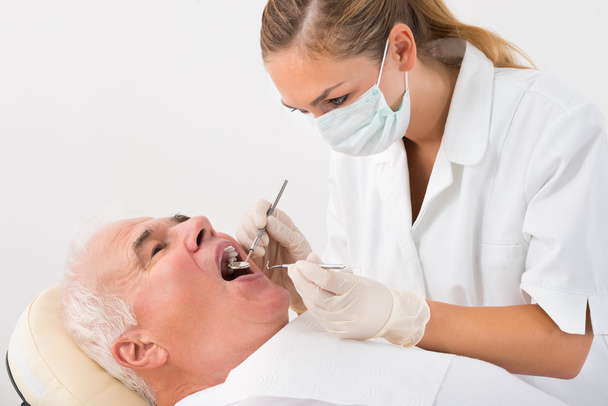 Man Undergoing Dental Treatment - Foto, imagen