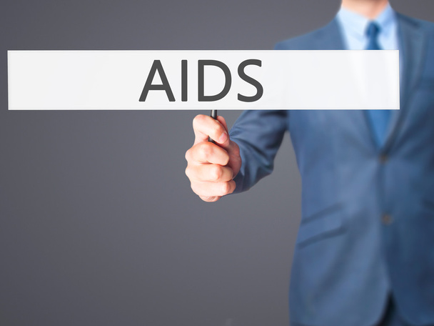 AIDS - zakenman hand hebt van teken - Foto, afbeelding