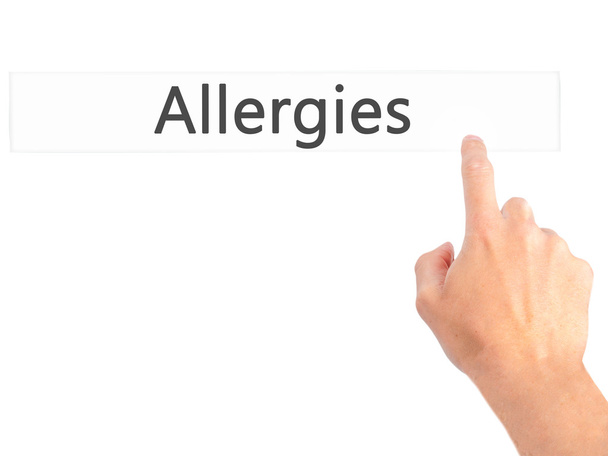 Allergien - Handdrücken auf Knopfdruck bei verschwommenem Hintergrundkonzept - Foto, Bild