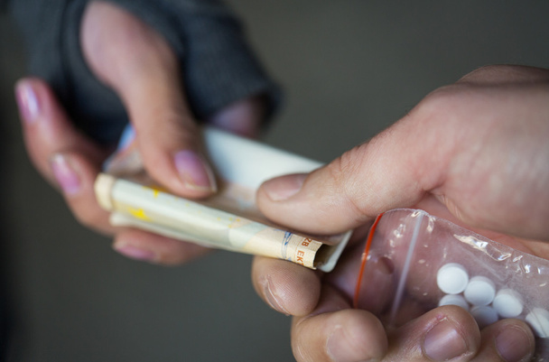 close up of addict buying dose from drug dealer - Foto, Imagen