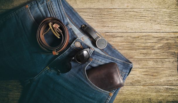 Jeans Wallet and Belt watches glasses  on wood background,top vi - Photo, Image