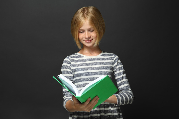 Cute girl reading book  - Фото, зображення