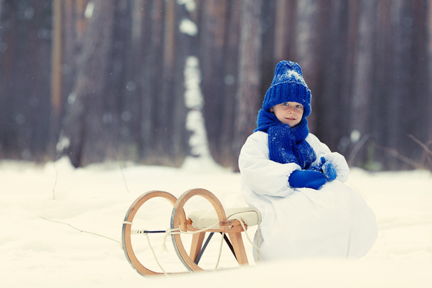 Happy boy in costumes snowman walking in winter forest, - Fotografie, Obrázek