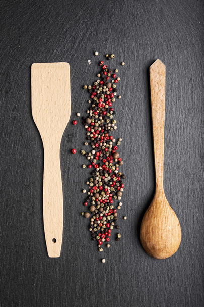 wooden spoon and spatula on slate, top view - Фото, зображення