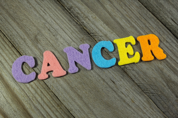 cancer word on wooden background - Fotó, kép