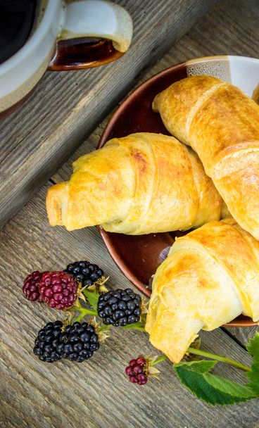 Croissants with BlackBerry and coffee for Breakfast. - Foto, afbeelding