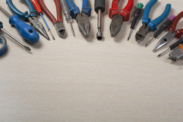 Set of electrical tool on wooden background. Accessories for engineering work, energy concept. - Φωτογραφία, εικόνα