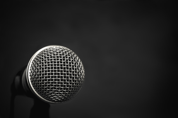 Microphone on wallpaper  background. - Photo, Image