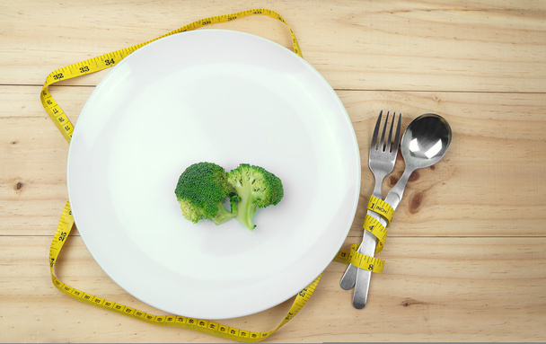 Diet healthy eating weight control concept. green broccoli  - Foto, afbeelding