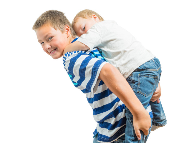 Loving Big Brother Carries Little Brother On His Back - Foto, Imagen