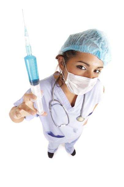 Nurse holding huge needle - Foto, imagen