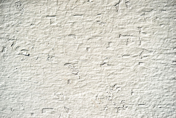 mur en bois blanc avec motif chaotique déprimé, comme fond neutre pour les présentations d'affaires
 - Photo, image