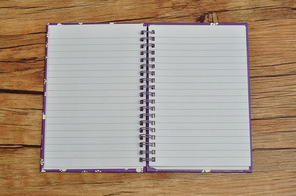 An open note book on a wooden background - Photo, Image