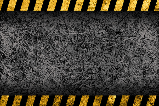 гранжевий темно-сірий фон з чорно-жовтими попереджувальними смугами
 - Фото, зображення