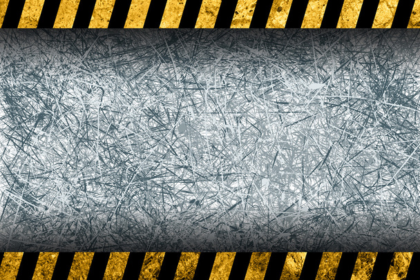 Grunge grauer Hintergrund mit schwarz-gelben Warnstreifen - Foto, Bild