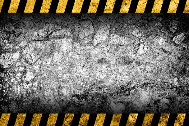 Grunge grey marble background with black and yellow warning stripes - Photo, Image