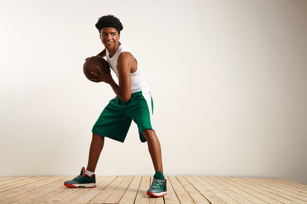 Young smiling black athlete playing basketball - Photo, Image