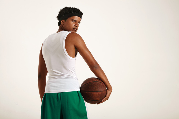 muscular black athlete holding  leather basketball - Фото, зображення