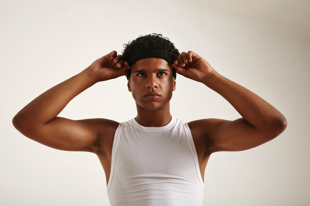 Young black basketball player adjusting his headband - Zdjęcie, obraz