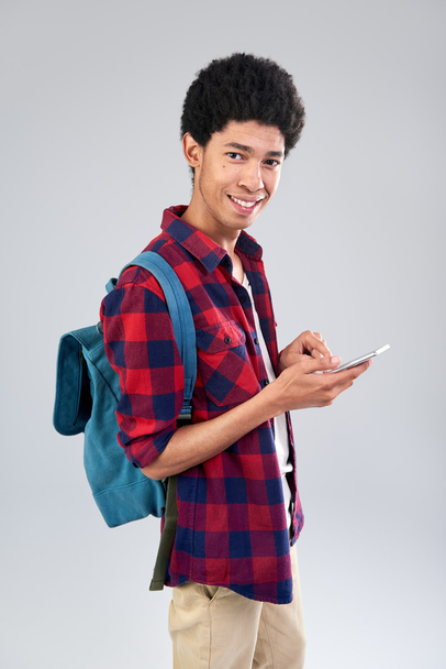 mixed race student browsing mobile - Foto, immagini