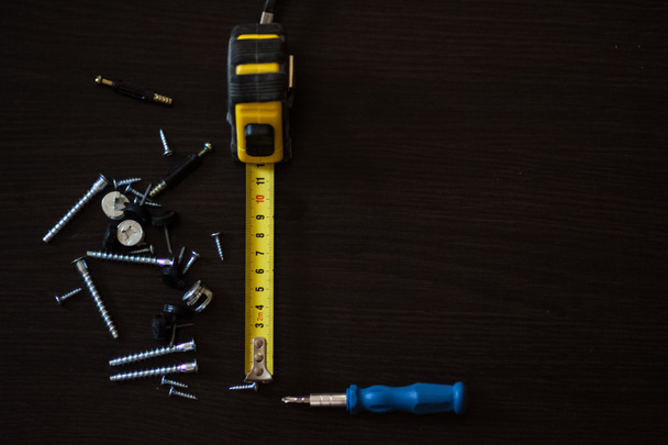 screws and nuts, tape, centimeter, subject shooting,  - Φωτογραφία, εικόνα