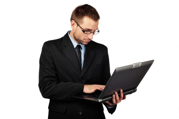Isolated businessman with laptop - Fotó, kép