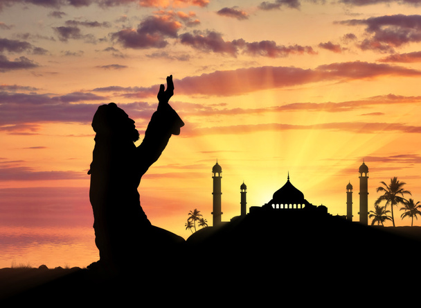 Muslim praying on a background of a mosque - Фото, изображение