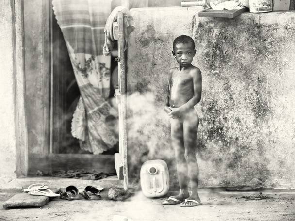 A Ghanaian girl is taking a shower - Photo, image