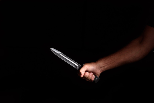 Man's hand with a knife - Foto, Imagen