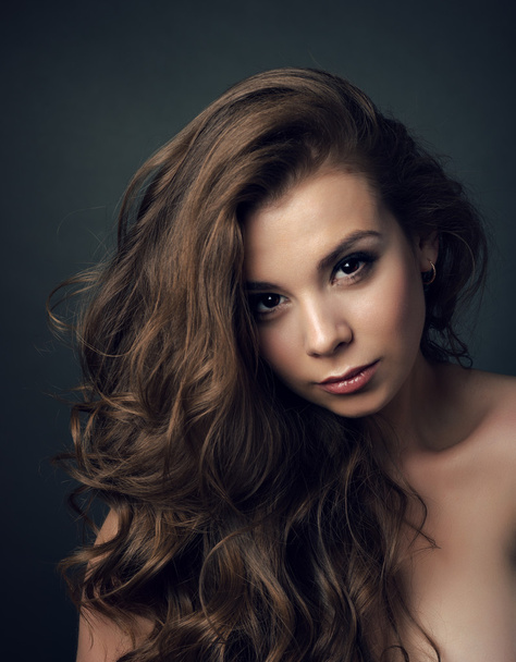 Portrait of a young beautiful brunette girl with long  hair - Fotoğraf, Görsel