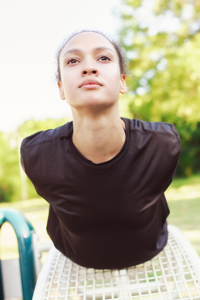 Young woman exercises gym outdoors - Valokuva, kuva