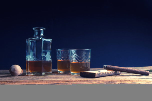 Cigar and whisky with ice on wooden table - Photo, Image