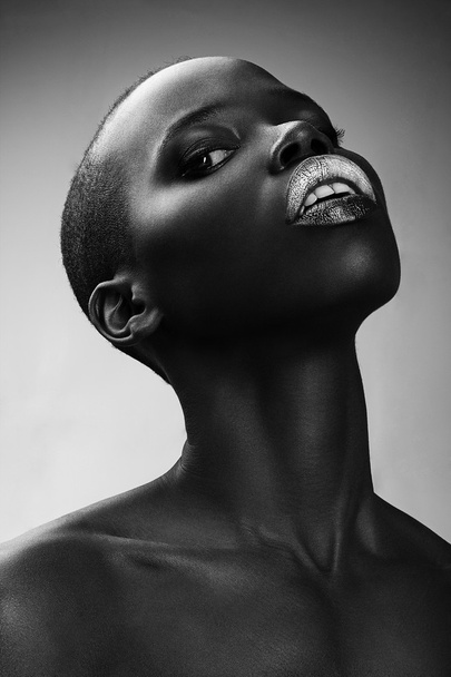 Black African American British fashion model with perfect skin long neck studio portrait - Foto, immagini