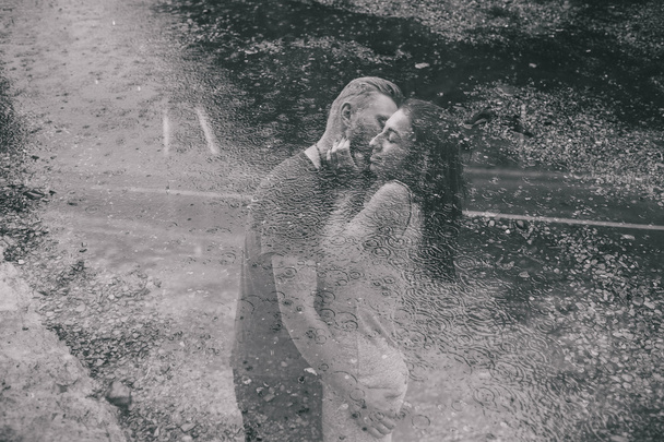 beautiful couple hugging in the rain - Zdjęcie, obraz