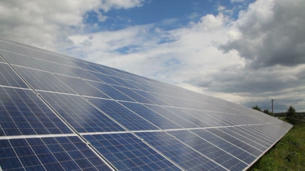 Solar panel produces green, environmentally friendly energy from the sun. Sunlight gleams off solar panel  - 映像、動画
