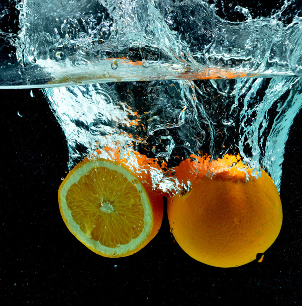 Orange Fruit Splash on water - Фото, изображение