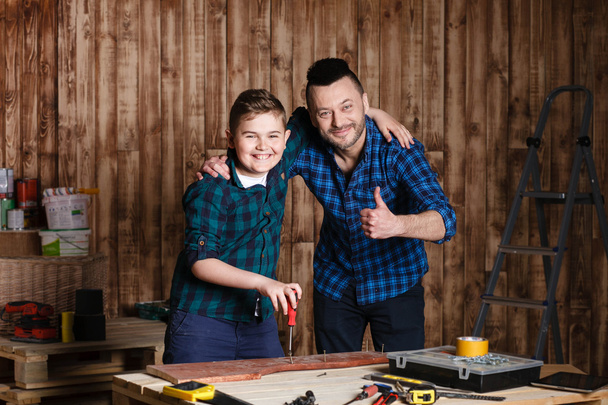 construction of father and son in the garage, family concept - Fotoğraf, Görsel