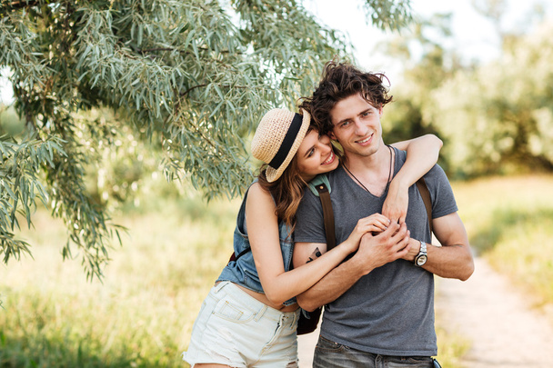 Young attractive hipster couple hugging at the forest - Φωτογραφία, εικόνα