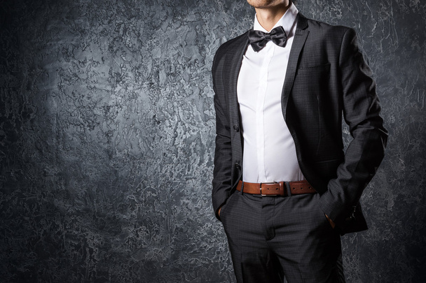 Stylish man in suit with bow tie - Foto, Bild