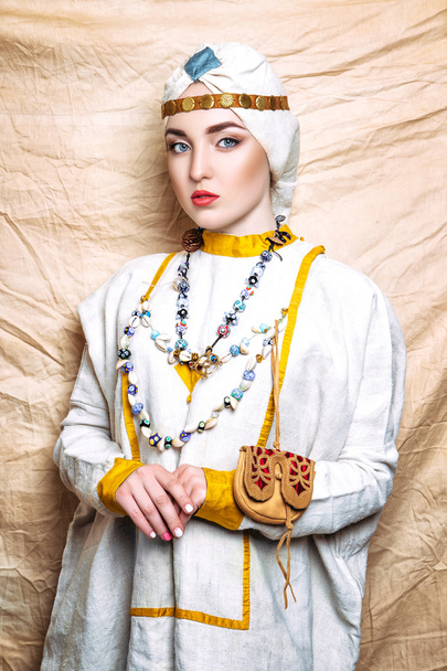 Portrait of slavic women from the past. Historical reconstruction. National vintage clothing. Studio - Photo, image